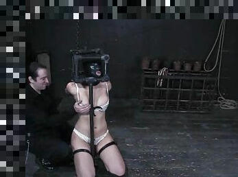 Penny Barber gets her ass fisted hard while being chained in pillory