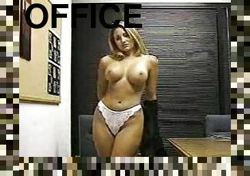 Gorgeous blonde girl in office clothes fondles her pussy