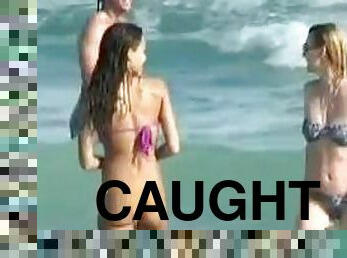 Jessica Alba wearing a purple bikini gets caught on voyeur's cam on a beach