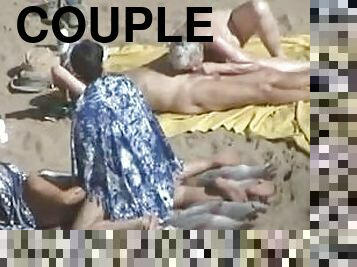 Kinky couple doesn't feel shy while making love on a nude beach