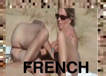 French wife lets her hubby finger her cunt on a beach