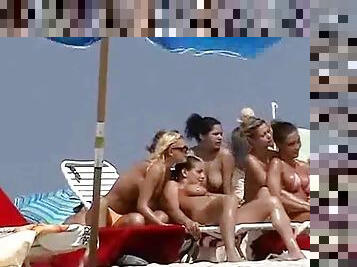 Nude beach hotties get filmed with a hidden cam while having rest