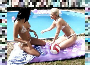 Two sizzling babes are toying each other on the poolside