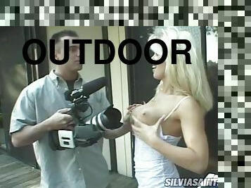 Dolly Golden sucks and rides Sean Rider's shaft outdoors