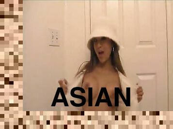 Hot Asian with fake tits stripping