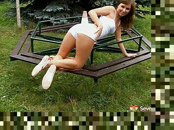 Amateur teen eases her shorts off for a superb masturbation outdoors