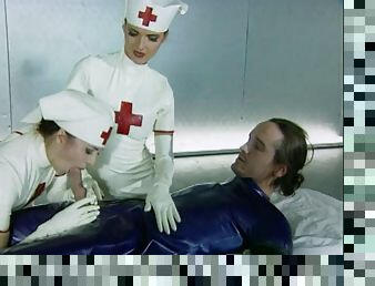 Kinky latex threesome with nurses and a patient fucking