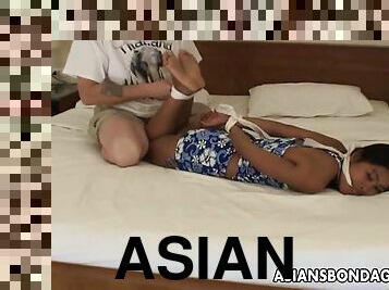 Bandit tickling Asian babes feet as shes tied up