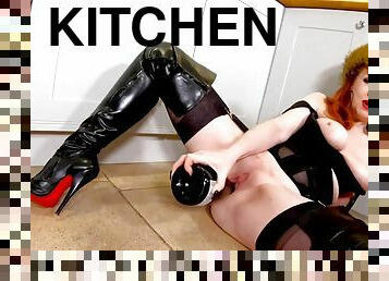 Red XXX masturbates in the kitchen