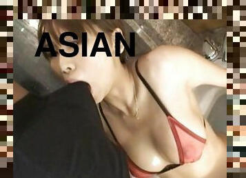 Provocative Asian escort in thong and stockings gives the best BJ