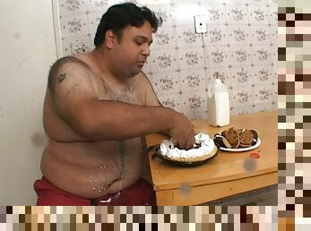 Fat guy with small cock eats a cake and gets a blowjob