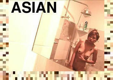 Shower with an Asian girl and watch her toy her cunt