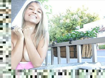 Beautiful Amie eats fruits and walks naked in a backyard