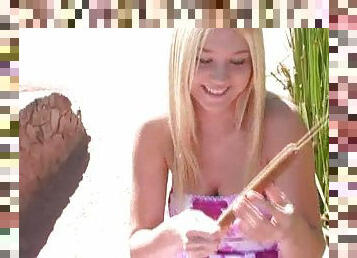 Playful Alison Angel lifts a dress up and has fun by the lake