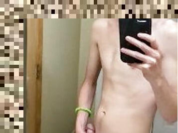 bored twink in a bathroom stroking thick cock