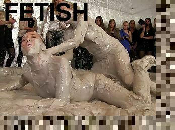 Vivacious blonde with a sexy body having a catfight in a mudbath
