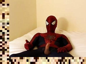 spiderman jerks off and cums all over his suit