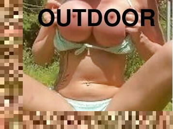 Outdoors smoking, wearing a bikini and showing of