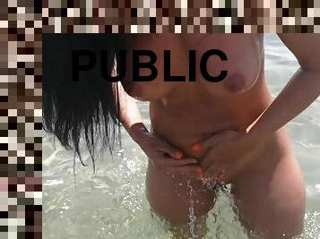 She sucks my cock on the public beach at sea and pees on it, milf conquered on the beach