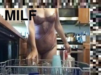 Horny milf does dishes and gets wet