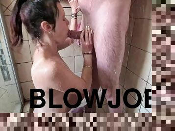 Sucking and gagging on a guy's cock while being under running water in the shower