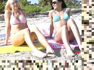 Brunette and blonde lesbian hook up while flirting on the beach