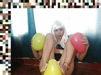 She plays with balloons and her feet (looners)