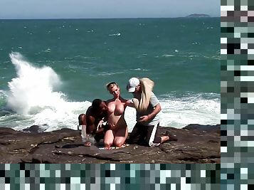 Dirty Blonde Whore Slurps On Two Dicks At The Beach