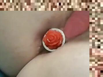 Wife uses rose buttplug and dildo.