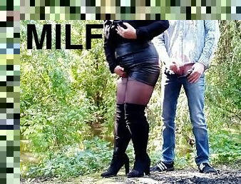 MILF in leather skirt gets a load on her ass outdoors