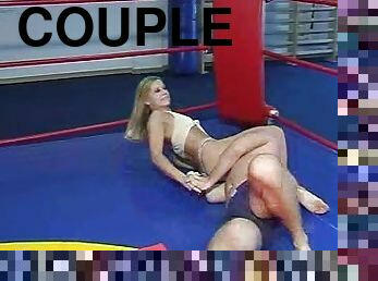 Impassioned couple dresses down for a wrestling match in the ring