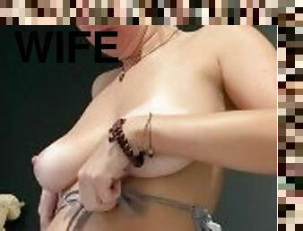Hotwife amateur American MILF having trouble getting her big saggy tits into bikini top, nice nips