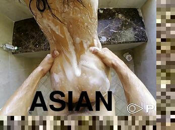 Exotic Asian cock sucker on her knees blowing a dick in the shower