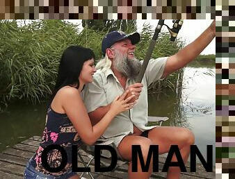 Bearded old man and a teen have hot sex in the grass