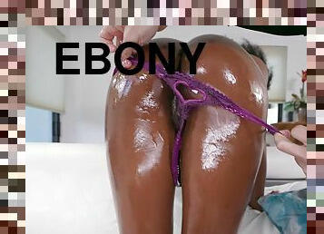 Oiled ebony girl Nicole Kitt moans while getting fucked by a white guy