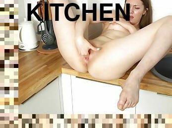 Closeup video of model Dominika D pleasuring her puss in the kitchen