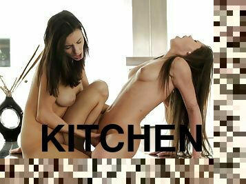 Lesbo babes Caprice and Gabi lick each other in the kitchen