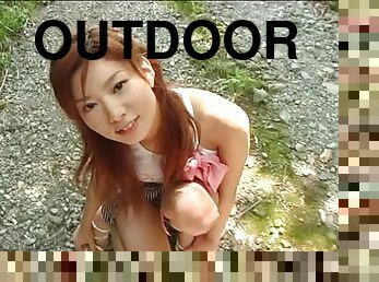 Lovely chick Aki Katase teasing with her firm boobies outdoors