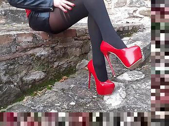 Foxy girl with fit legs and red high heels loves teasing with her feet