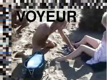 Voyeur masturbates on the beach