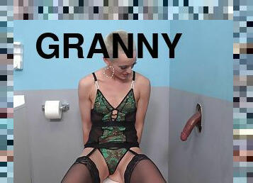 Short hair granny Sidra Sage blows and rides dicks thru a gloryhole