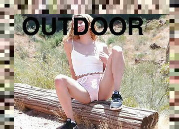 Fit teen Allie spreads her legs to pleasure her pussy in outdoors