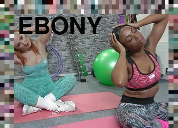 Redhead cutie and sexy ebony model have sex in the locar gym