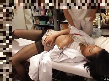 Foxy Japanese doctor spreads her legs to be fingered on the bed