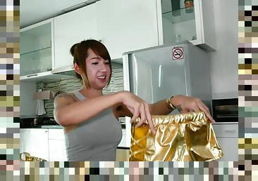 Thai shemale Nanny puts on herself sexy golden outfit for looking like an expensive slut.