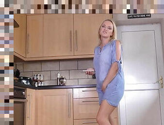 Sexy blonde pissing at the kitchen