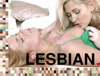 Blonde friends lick each other on the bed and moan together