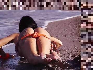 Teasing pornstar Mya Diamond undressing by the sea. Hd video