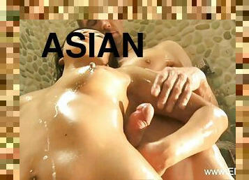 Sexy Asian milf giving sexy Nuru massage outdoors in Asia.