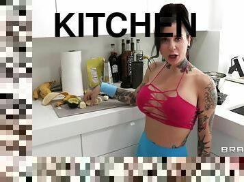 Tattooed pornstar Joanna Angel teases in the kitchen and rides